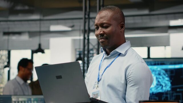 Engineers in office doing software development to launch new features. Startup company IT workers writing computer programs, doing code testing and quality assurance, camera B