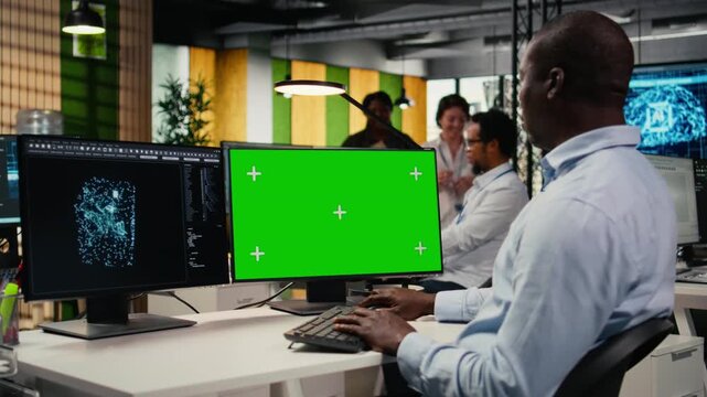 Isolated screen PC used by admin in office using specialized hardware to accelerate complex AI calculations. IT expert managing deep learning training datasets with chroma key computer, camera A