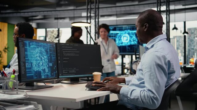 Data scientist in office automating workflows using artificial intelligence on PC. IT professional refines deep learning computational models on computer for faster processing, camera A