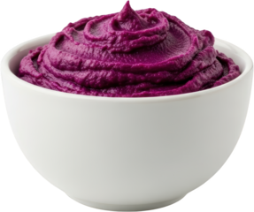 A white ceramic bowl filled with creamy vibrant purple sweet potato mash swirled to a peak on a transparent background puree food healthy smooth dessert