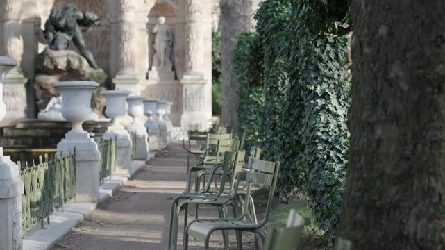 Cinematic Tilt Up on Park Chairs Toward Medici Fountain at Sunset Paris France
