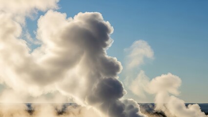 Large white clouds against a clear blue sky with a sunny horizon