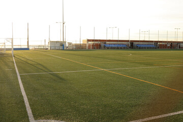 Soccer training pitch in daylight with empty field.