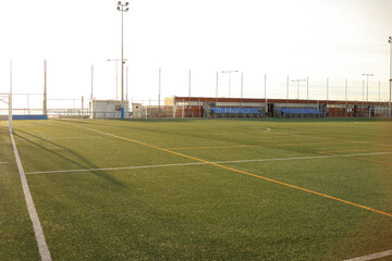 Soccer training pitch in daylight with empty field.