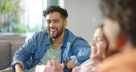Diverse friends hearing woman speaking, sharing popcorn container and laughing on gray couch - Powered by Adobe