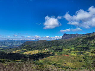 Mountain Landscape with Green Valleys and Blue Sky