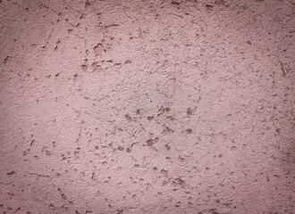 Cement surface in pink tones with a vignette effect. Copy space 