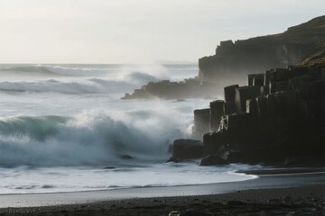 Waves crashing against basalt columns on a rocky coastline