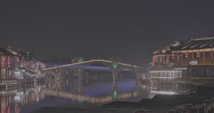 Captivating Night Bridge Spectacle Over Reflective Waters in Town. Zhujiajiao, Shanghai, China