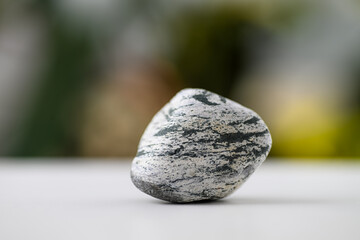 Close up of Light Rock on White Surface