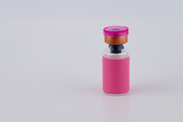 Close up of Glass Vial with Pink Label