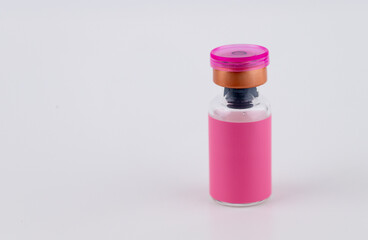 Close up of Glass Vial with Pink Label