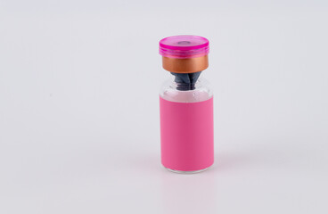 Close up of Glass Vial with Pink Label