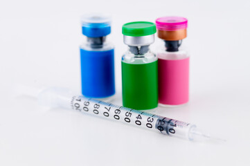 Close up of Glass Vials with Single Use Syringes