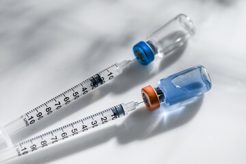 Close up of Single Use Syringes in Glass Vials