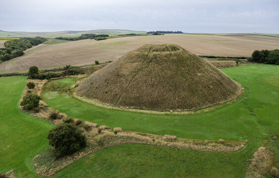 Silbury Hill prehistoric man made chalk and clay mound near Avebury stone circle henge, England. 39m high. Earliest dates from 2400BC. View from NE