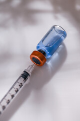 Close up of Glass Vial with Single Use Syringe