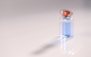Multiple Exposure Photo of Glass Vial with Light Blue Liquid Inside