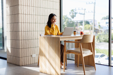 Woman using laptop computer, working at cafe. Casual business, freelance work, distance studying,...