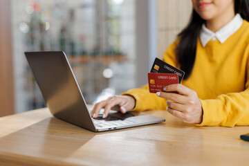 Customer verified online purchase with credit card and laptop at office desk. tax payment e...