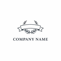 Elegant minimalist logo design with a banner, laurel wreaths, and 