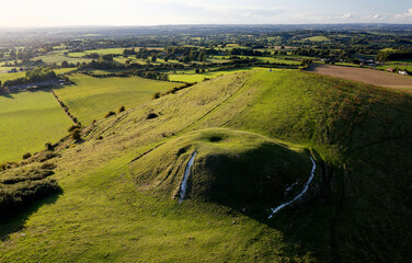 Cley Hill Camp univallate Iron Age hillfort near Warminster, Wiltshire. The larger of the 2 central Bronze Age bowl barrows seen from the south east