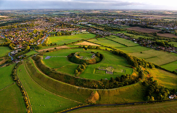 Old Sarum, Salisbury, dates from 3000 BC Neolithic. Shows Iron Age hillfort, Norman central motte and bailey and cathedral ruin. Salisbury city behind