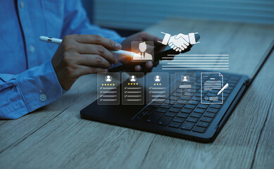 Businessman using smartphone and laptop with digital HR interface icons illustrating online recruitment, candidate evaluation employee profile management, modern human resources technology solutions