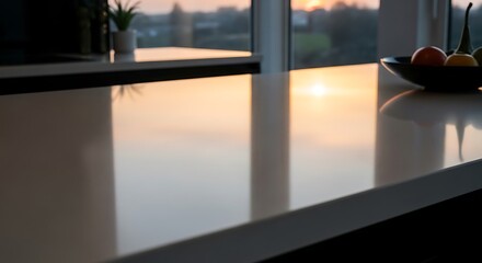 Fototapeta premium Modern Kitchen Countertop Reflecting a Golden Sunset.