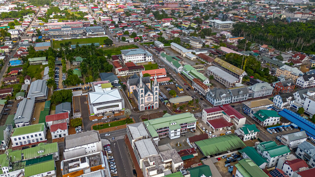 Aerial shot capturing the Saint Peter and Paul Cathedral surrounded by the historic colonial buildings and streets of downtown Paramaribo