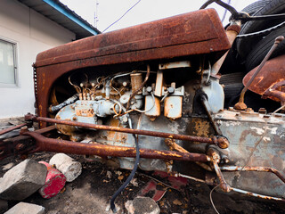 Old rusty vehicles in a vintage industrial setting