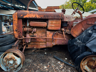 Old rusty vehicles in a vintage industrial setting