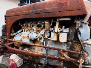 Old rusty vehicles in a vintage industrial setting