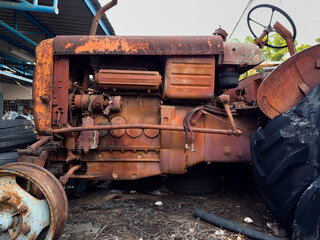 Old rusty vehicles in a vintage industrial setting