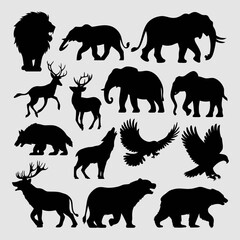 Naklejka premium Collection of black silhouettes of various wild animals including lions, elephants, bears, and birds isolated on