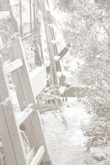 Cloud Dancer color of 2026. Monochrome photo. Trend color of the year. Greenhouse with plants and a staircase in the foreground.