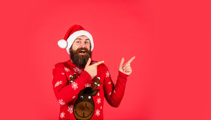 Emotional brutal hipster favorite winter sweater red background. Cozy winter wishes. Dashing Through the Snow. Bearded man santa hat. Winter holiday fun. Santa man. New year party. Christmas time