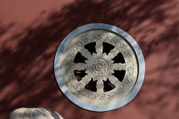 old antique stone medallions on the red wall