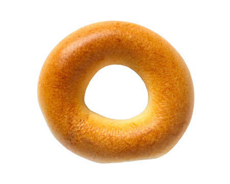 One small dry bagel isolated on a white background. Close-up of a bagel