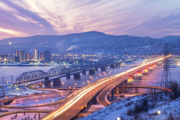 Fototapeta premium Beautiful bridges in the night illumination. Nikolaevsky Fourth Bridge in Krasnoyarsk, Russia and the railway bridge over Yenisei River. Traffic and urban transport movement, Siberian city in winter