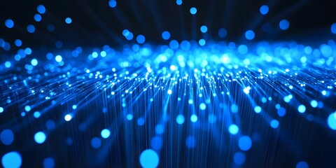 Abstract glowing blue light particles emanating from a central point creating a futuristic and ethereal digital network or data stream effect