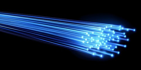 Close up view of a bundle of bright blue fiber optic strands illuminated with a vibrant glow against a deep black background creating a sense of futuristic technology and data transmission