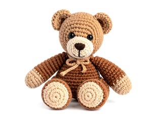 Crochet teddy bear, light brown, tan, and dark brown accents, sitting against a white backdrop