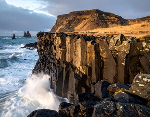 Coastal landscape featuring basalt cliffs and ocean waves