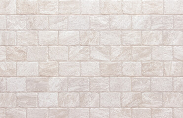 Naklejka premium Detail of modern cream brick wall background photo. White light brick wall texture background for stone tile block painted in beige light color wallpaper modern interior and exterior backdrop design.