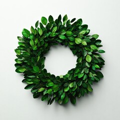 Lush green circular wreath made of small, tightly packed leaves on a white background