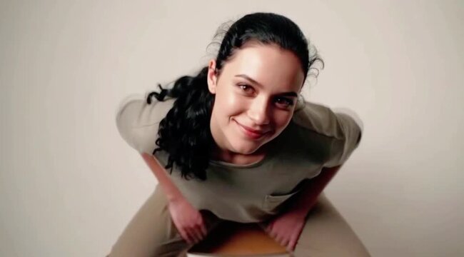 A young pretty woman seen from a drone view speaking boldly about her vision with confidence and charisma Generative AI