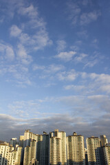 A city with blue skies and apartments