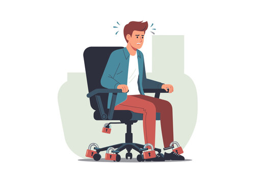 Man sitting in office chair with feet chained to desk legs.