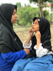 A Sweet Moment of a Child Asking Her Mom a Question